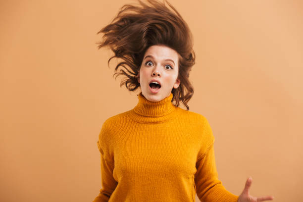 istock Shocked young woman looking camera. 1303004999