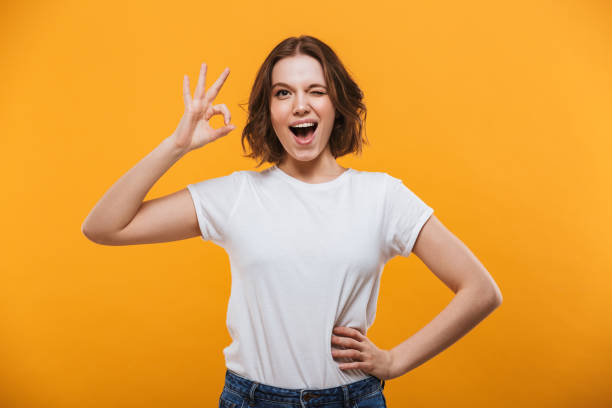 istock Happy young woman make okay gesture. 1303005039