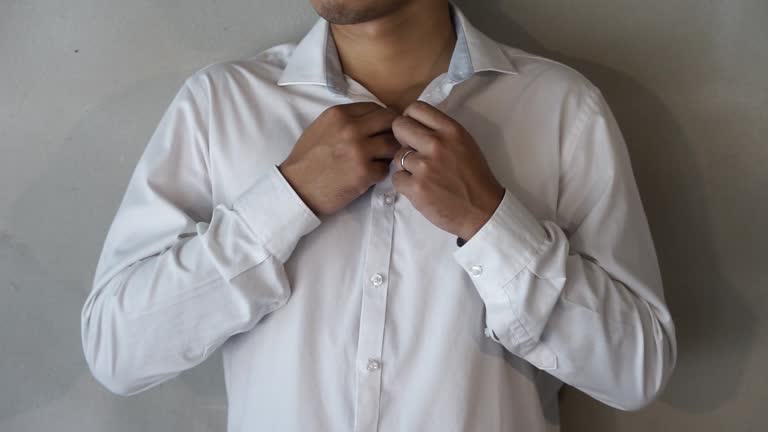 Men wearing white shirt, button-down shirt.