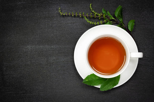 istock Tulsi or holy basil tea in white cup 1303005469
