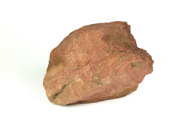 istock Brown stone isolated on white background. 1303005616