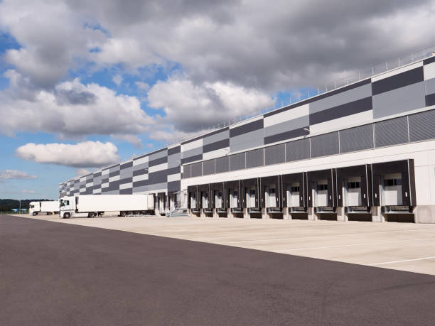 istock Large distribution and logistic warehouse. Row of Loading ramps. 1303008468
