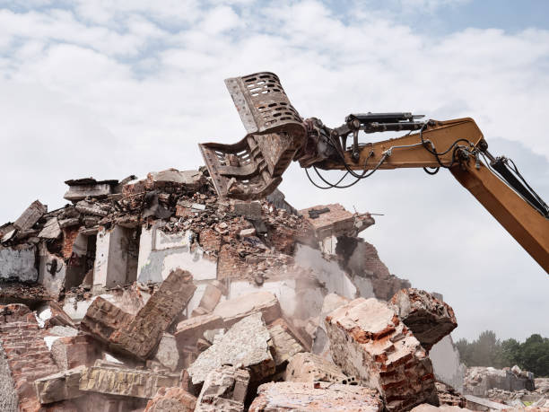 istock Old building demolition. Excavator working in rubble. 1303008470