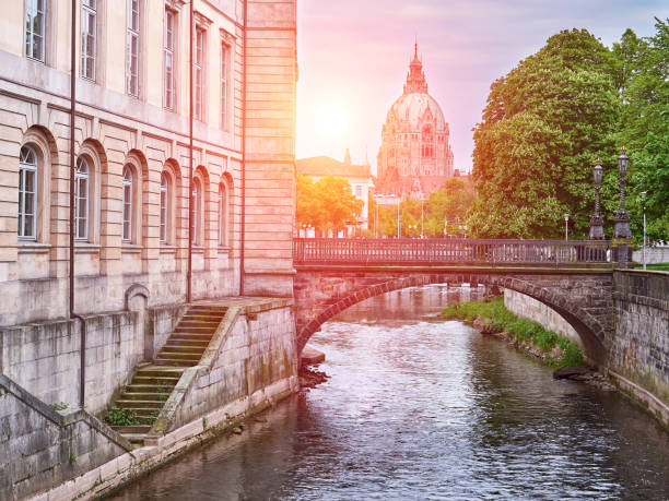 River Leine in Hanover city. City Hall background. View at sunset stock photo