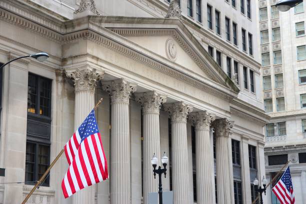professional illustration of Federal Reserve headquarters with classical columns and American flag