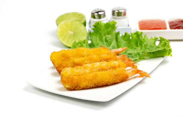 istock breaded shrimp on white plate isolated on white background 1303009619