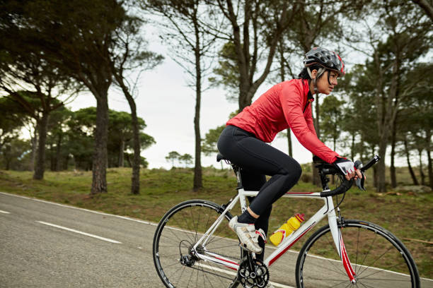 istock Female Triathlete in Early 50s Training on Racing Bicycle 1303009823