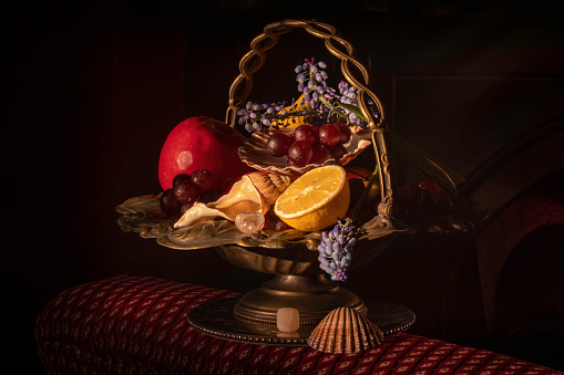 This still life have been composed with vintage brass basket in Edwardian style house. Evening sunlight.