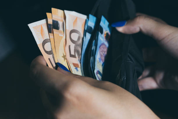 istock money in my wallet 1303011061