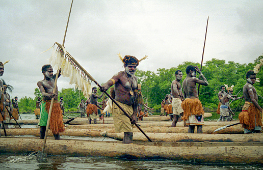 West Papua, Indonesia (formerly known as Irian Jaya, Indonesia) October 9,1999.  Asmat warriors in dugout canoes explore inaccessible locations.