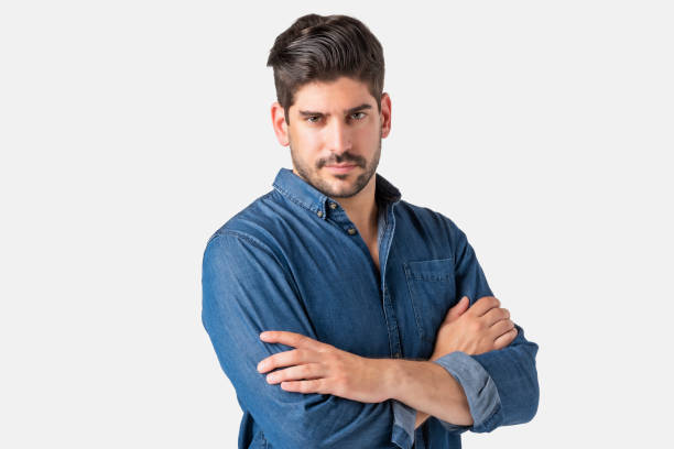 istock Serious faced businessman studio portrait while standing at isolated white background 1303011882