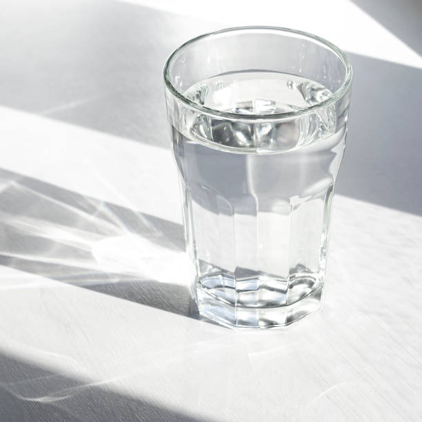 istock A glass with pure clear melt water stands on a white table 1303012240