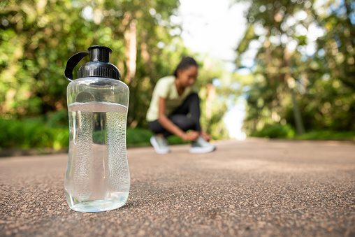 a woman with   bottle of water