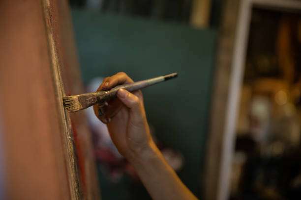 istock Artist at work painting 1303014405