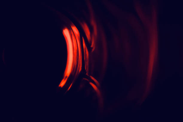 istock Reddish blurry lights with black background photo 1303014601