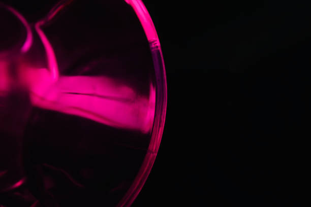 Pink curvy glass with blurry lights unique photo