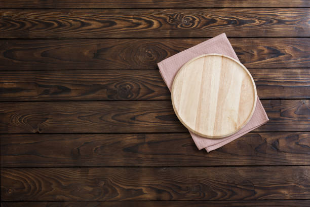 istock wooden dishes on  old wooden table 1303019516