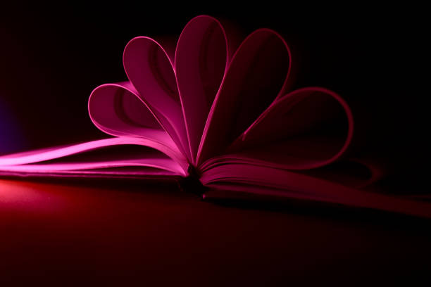 Folded pink papers of a notebook unique stock photo