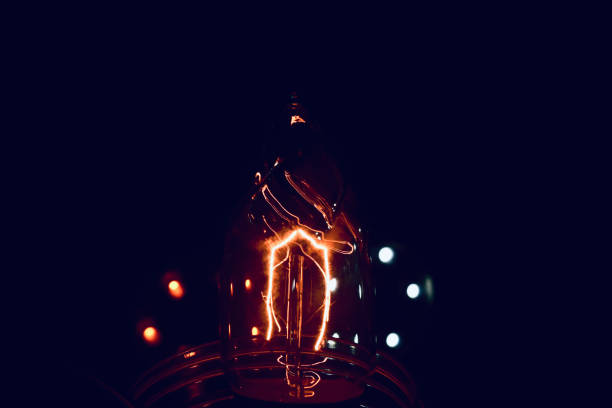 istock Reddish filament electric lights bulb 1303020778