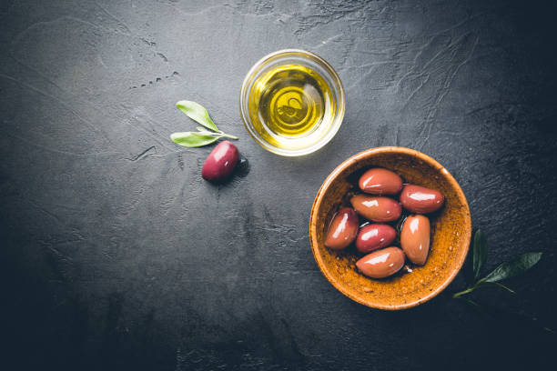istock Black olives and olive oil 1303020799