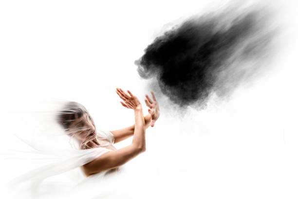 A conceptual image of a woman floating in space toward a bright light.