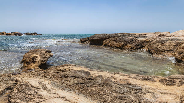 istock Rocks and water in a spanish beach 1303025029