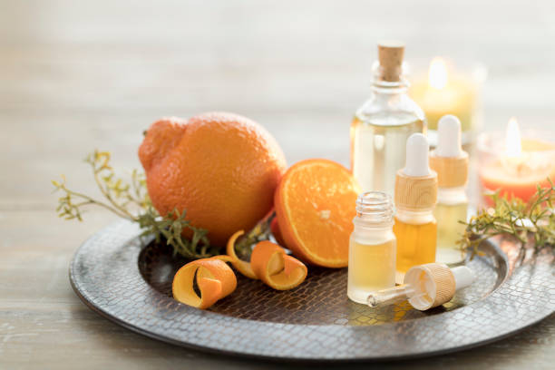 istock Essential Oils with Orange and Candles 1303027008
