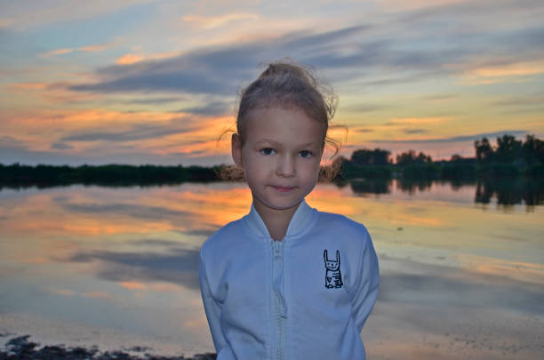 istock Mom and daughter  sunset. 1303027871