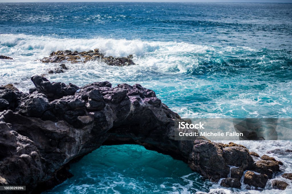 Mermaid Caves Gorgeous arch over the ocean on the North Shore of Maui Beach Stock Photo