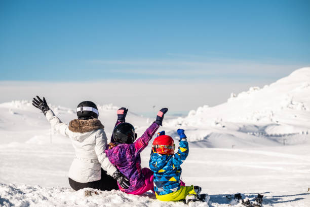 istock Skiing family having fun on winter day 1303035110