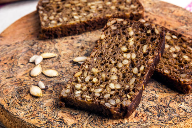 istock Sliced rye bread baked with sunflower seeds. 1303036270