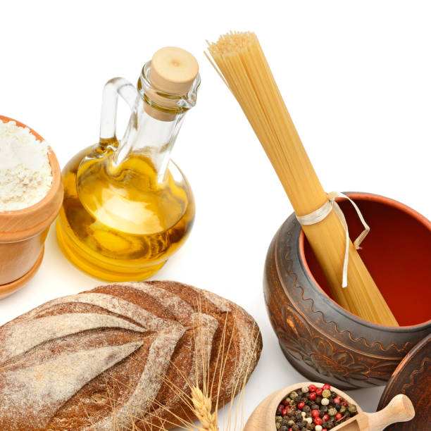 Bread, pasta, olive oil and spices isolated on a white background. Healthy food.