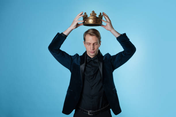 istock Crown yourself, a successful young businessman with a crown over head. 1303037457