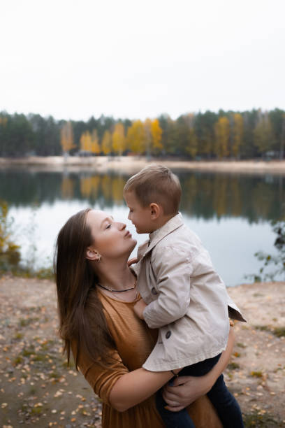 istock Beautiful mother holds a son in her arms 1303037460