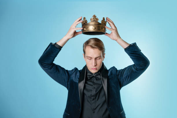 istock Crown yourself, a successful young businessman with a crown over head. 1303037463