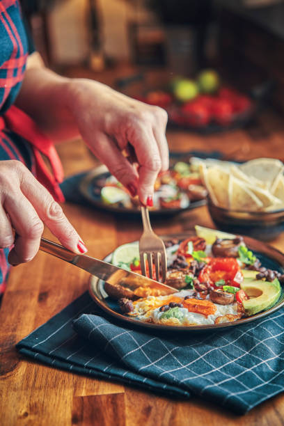 istock Mexican Style Breakfast with Eggs, Mushrooms, Beans, Tomatoes, Avocado and Tortilla 1303037524