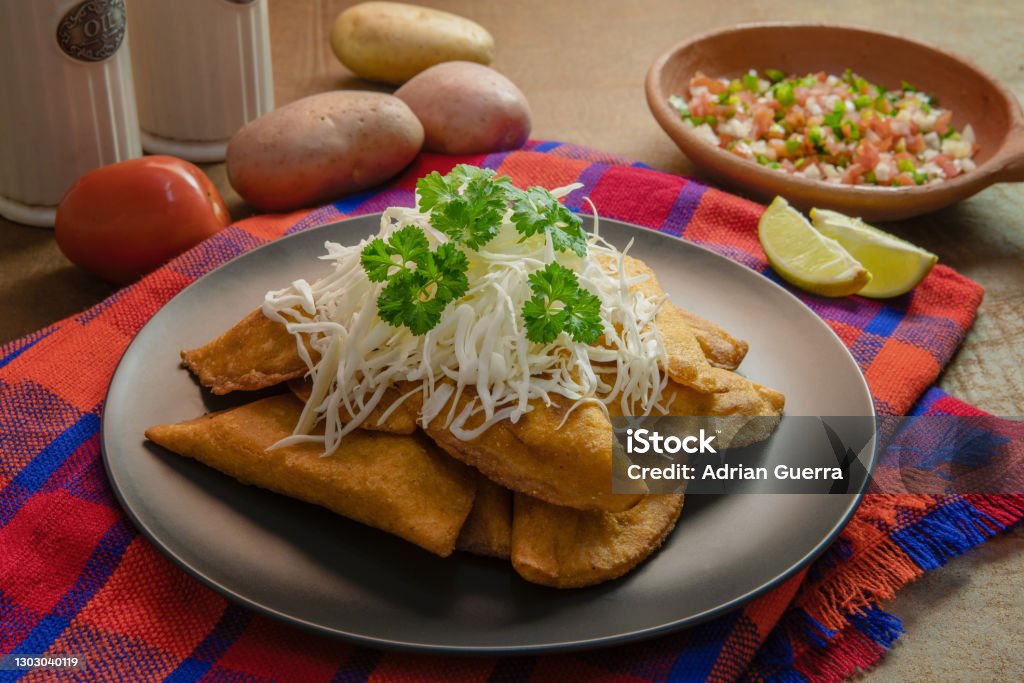 homemade stuffed meat empanadas on a background also called pastelitos de perro in honduras A typical plate  made in Latin America countries Honduras Stock Photo
