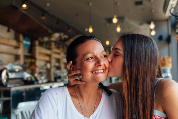 Love Of Mother And Daughter Love of mother and daughter. Happy women in a nice cafe with copy space on blurred background. Mothers day. daughter stock pictures, royalty-free photos & images