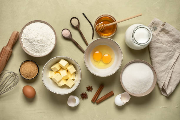 istock Baking ingredients on a beige concrete background. Top view. 1303042687