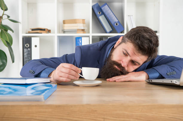 istock Hard morning. Bearded hipster formal suit relaxing with coffee. Office life. First coffee. Sleepless night. Procrastination is thief of time. Man handsome boss sleep in office drinking coffee 1303047737