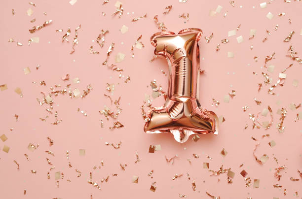 istock Shiny balloons with glitters on festive background. 1303048745