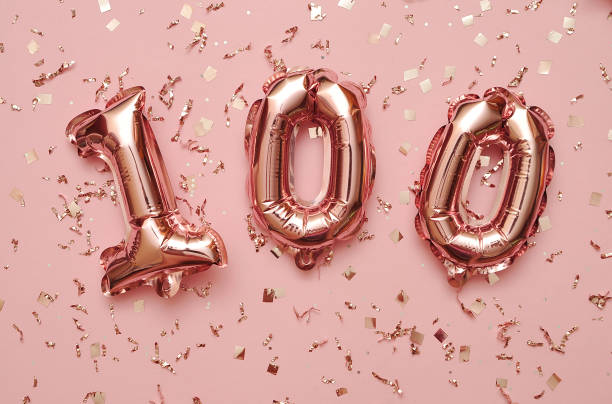 istock Shiny balloons with glitters on festive background. 1303048748