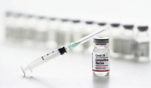 istock Corona Vaccine Bottles and Syringe 1303051379