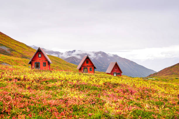 Hatcher Pass Red Cabins Three Red Triangle Cabins Sit On The Top Of A Hill Surrounded By The Hatcher Pass Mountains Of Alaska. talkeetna mountains stock pictures, royalty-free photos & images