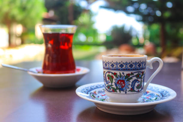 Turkish coffee and tea in traditional cups in a street restaurant. Close-up, selective focus Turkish coffee and tea in traditional cups in a street restaurant. Close-up, selective focus. nevsehir stock pictures, royalty-free photos & images