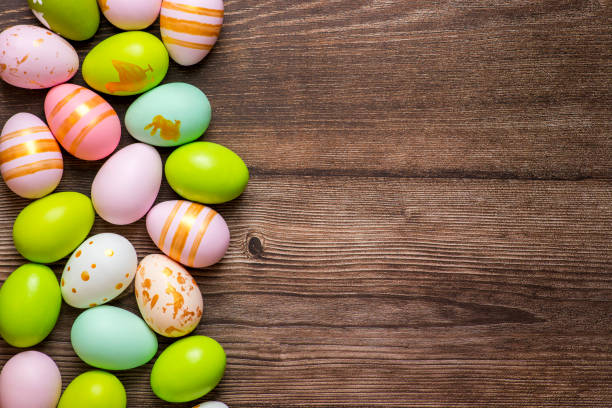 istock Colorful Easter eggs on wooden background, flat lay. Space for text. 1303052744