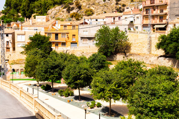 facades of colorful houses and the park of the spanish old town built in the mountains. - roof tile architectural detail architecture and buildings built structure imagens e fotografias de stock