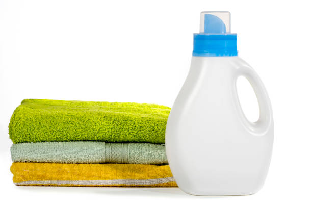 istock Plastic container for detergents and towels on a white background. Cleaning concept. 1303059609
