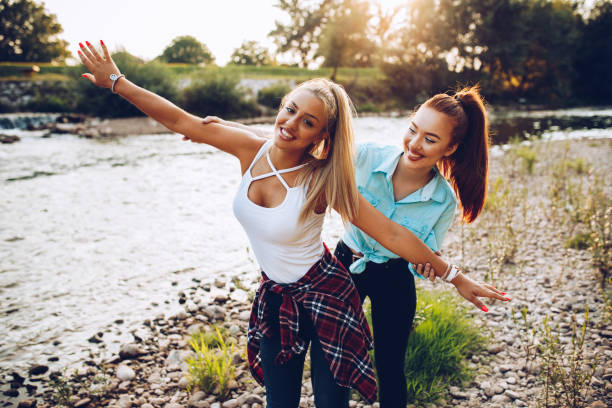 istock Girlfriends spending summer day on the river 1303061870