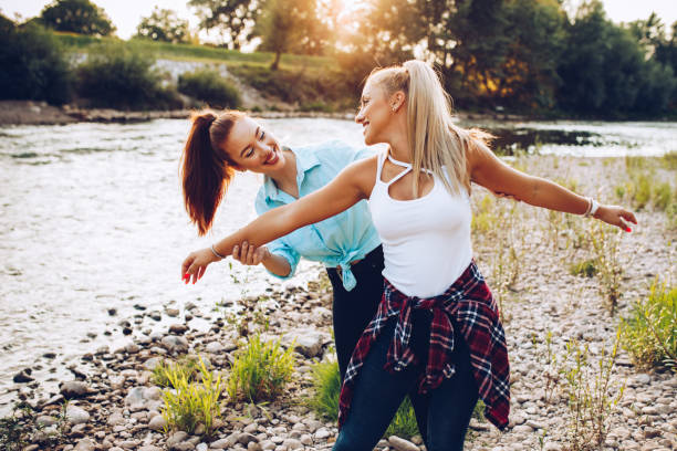istock Girlfriends spending summer day on the river 1303062104